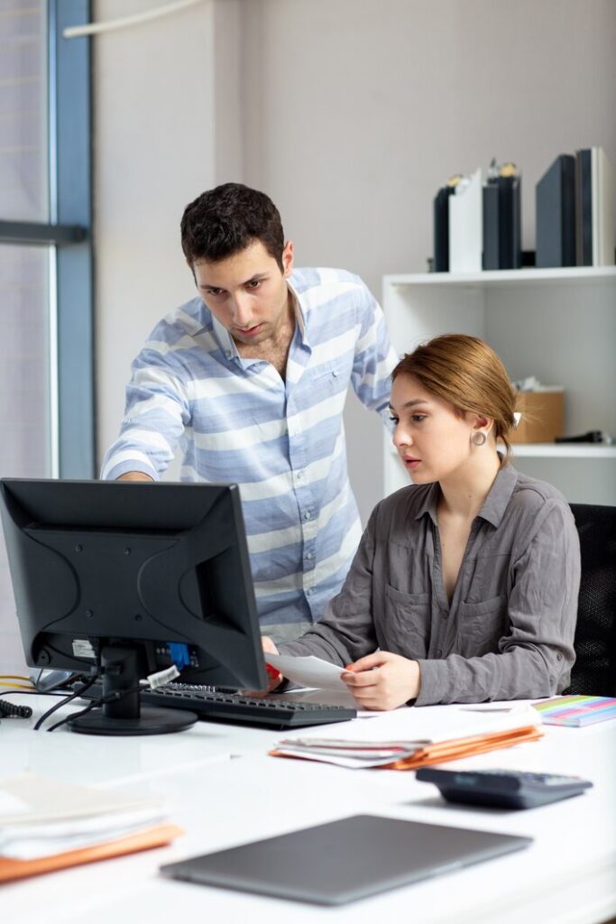 girl and boy doing work in office
